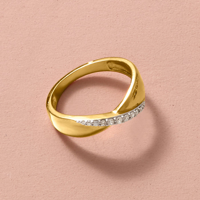 Gold ring band with channel-set diamond stones across the top, close-up.
