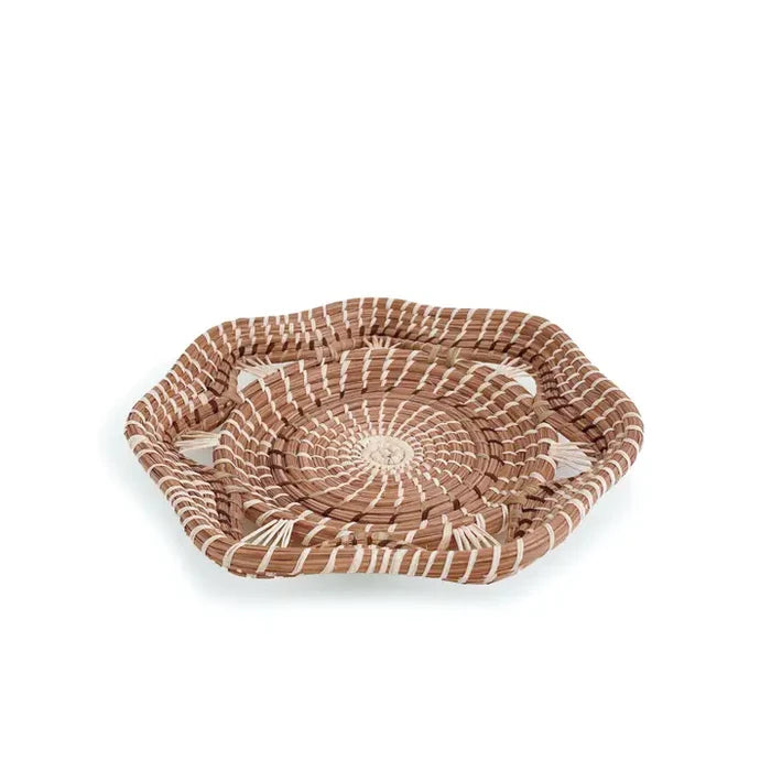 Woven basket with a circular pattern on a white background