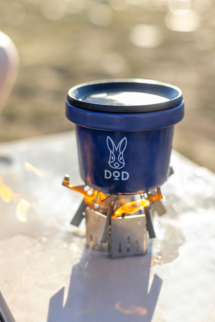Blue DQD camping pot with white rabbit logo on Ashura Mini Stove