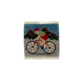 Small woven rug with a cyclist design on a white background
