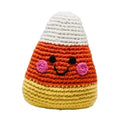 Crocheted candy corn toy with a happy face on a white background
