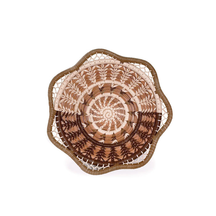 Decorative woven plate with a spiral pattern on a white background