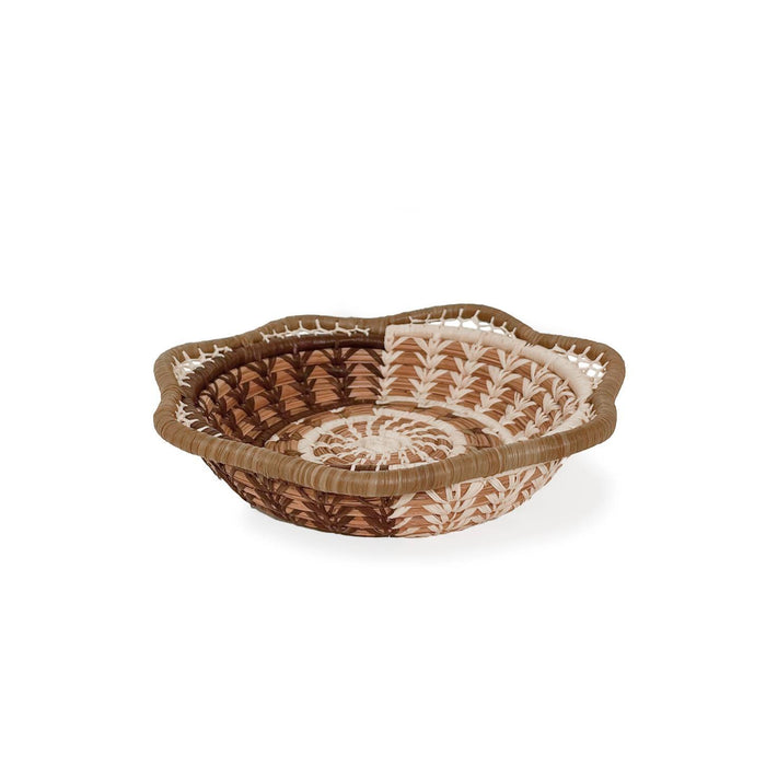 Woven basket with decorative patterns on a white background