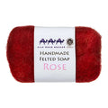 Red handmade felted soap with a white label on a white background