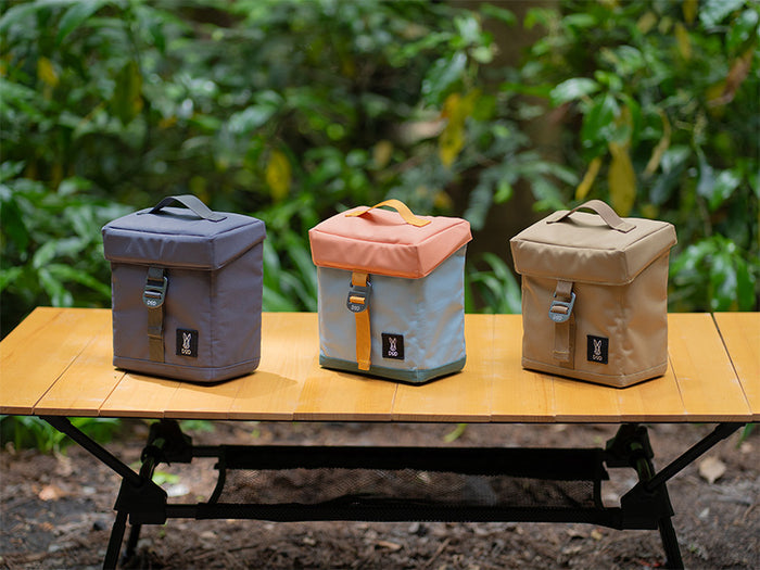 Glacier Bundle: gray, peach, tan cooler bags with handles on table