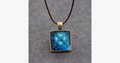 Glowing Pyramid Pendant with Blue Crystal – Add Some Shine and Color To Your Collection