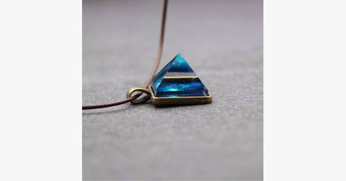 Glowing Pyramid Pendant with Blue Crystal – Add Some Shine and Color To Your Collection