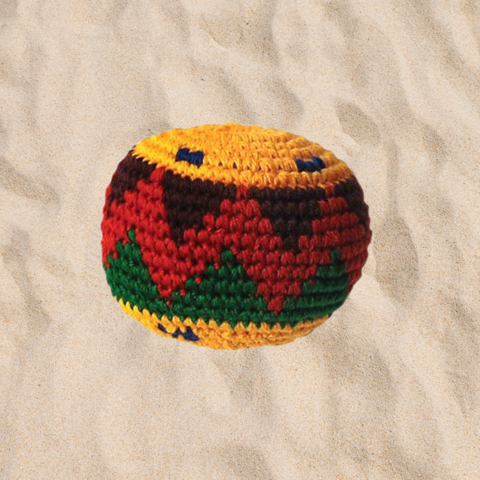 a hacky sack in the sand