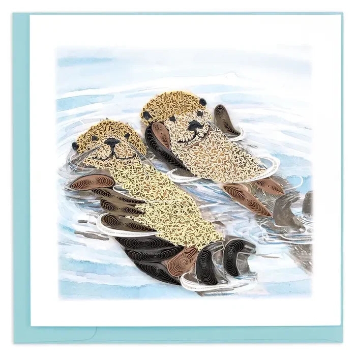 Quilled design of two otters in water with a light blue border