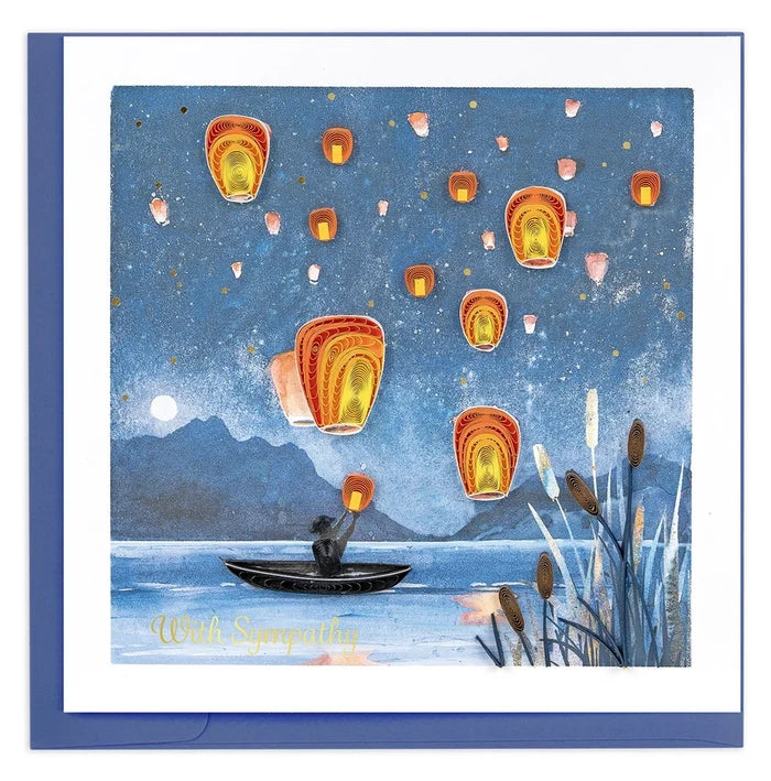 Quilling Card with a person in a boat releasing lanterns into a night sky over water.