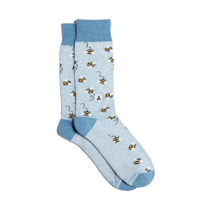 Light blue socks with bee pattern on a white background