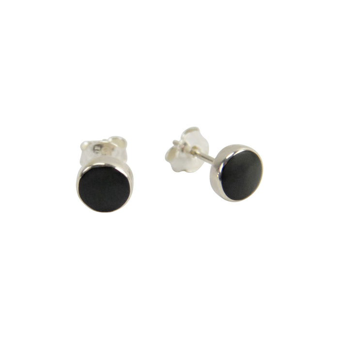 A pair of silver stud earrings with round black inlay discs, shown from both front and side angles on a plain white background.