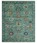 Teal and yellow Oushak-style wool rug with multicolor floral medallion pattern