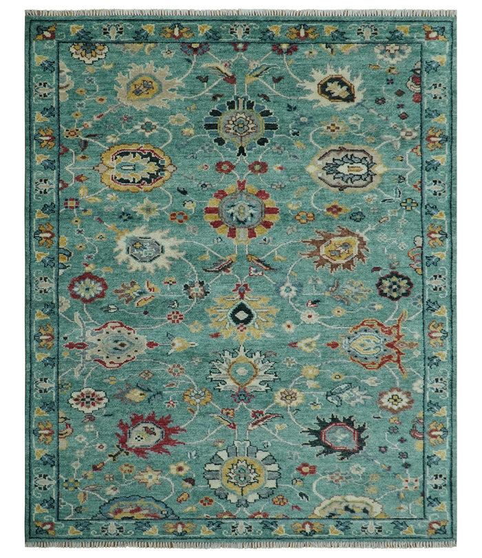 Teal and yellow Oushak-style wool rug with multicolor floral medallion pattern